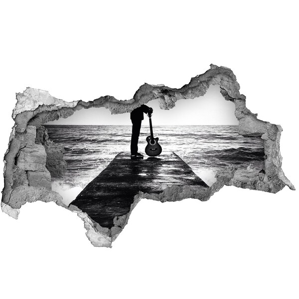 Adesivo con vista dietro il muro Musicista sul molo