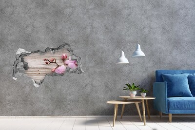 Sticker effetto rottura muro Fiori di orchidea su sfondo di legno