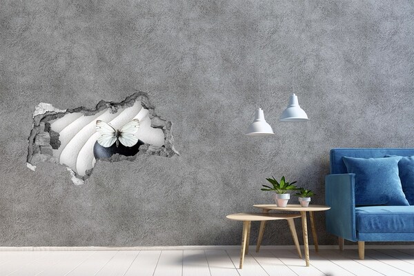 Adesivo con vista dietro il muro Una farfalla su una pietra in un ambiente zen.
