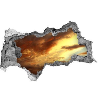 Sticker effetto rottura muro Tramonto attraverso un buco nel muro