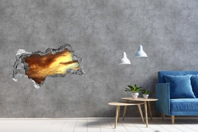 Sticker effetto rottura muro Tramonto attraverso un buco nel muro