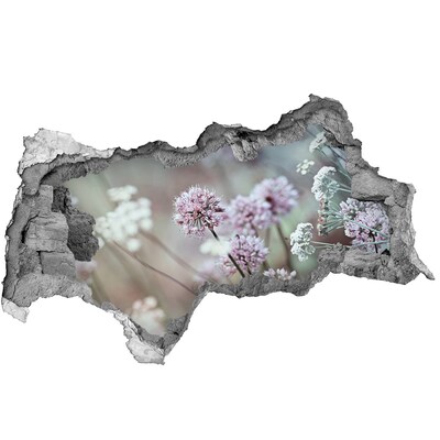 Adesivo con vista dietro il muro Fiori in una buca di cemento