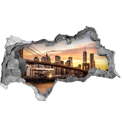 Adesivo con vista dietro il muro Ponte di Brooklyn al tramonto