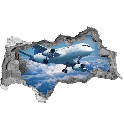 Sticker effetto rottura muro Arrivo di un aereo tra le nuvole