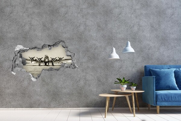 Adesivo con vista dietro il muro Un vecchio aereo sulla pista dell'aeroporto.