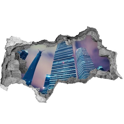 Sticker effetto rottura muro Città moderna vista attraverso un buco nel muro