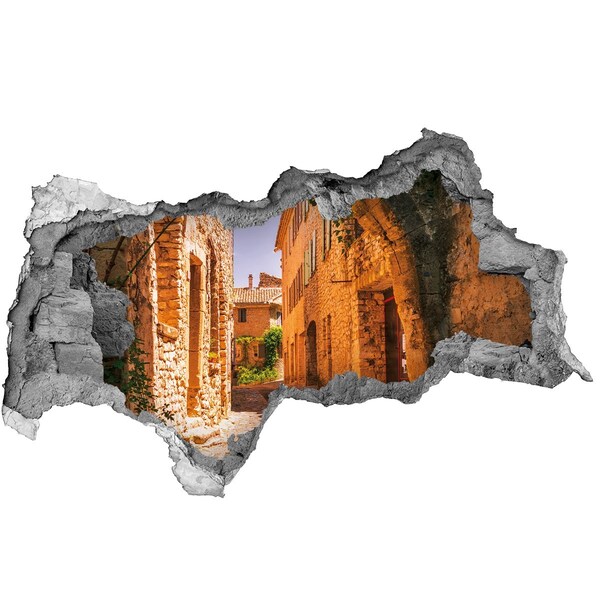 Adesivo con vista dietro il muro Il fascino di una strada medievale