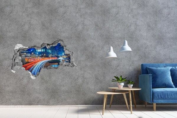 Adesivo con vista dietro il muro Città moderna di notte