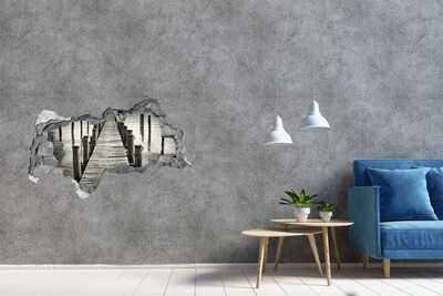 Adesivo con vista dietro il muro Ponte di legno sull'acqua