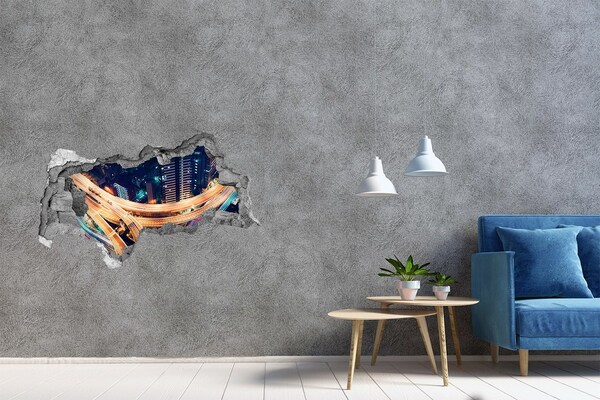 Adesivo con vista dietro il muro Veduta notturna della città