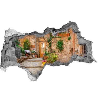 Adesivo con vista dietro il muro Una cittadina affascinante in Italia