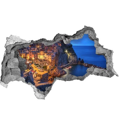 Sticker effetto rottura muro Una pittoresca cittadina costiera