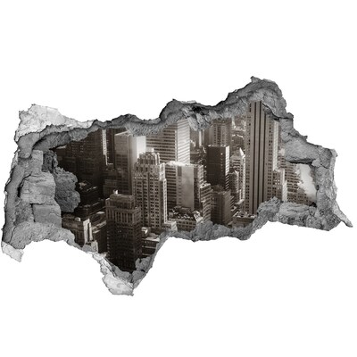 Sticker effetto rottura muro Vista della città da un buco nel muro