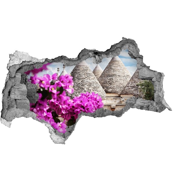 Adesivo con vista dietro il muro Trulli in Puglia con fiori