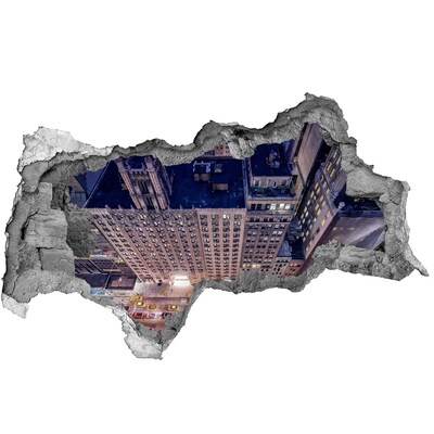 Decorazione da parete buco nel muro Vista notturna della città dall'alto.