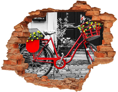 Adesivo con buco sbrecciato Una bicicletta rossa in un contesto urbano.