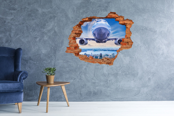 Adesivo con buco sbrecciato Un aereo sopra la città