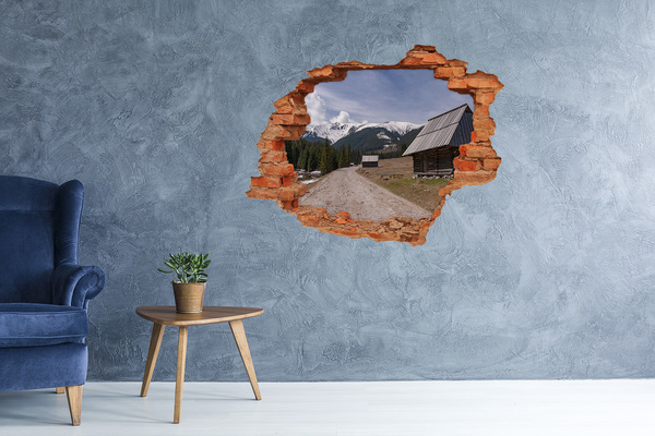 Adesivo murale buco 3D Paesaggio montano con capanne