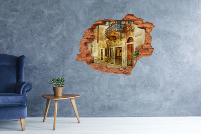 Adesivo effetto buco nel muro Una casa in rovina in un contesto pittoresco