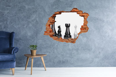 Adesivo con buco sbrecciato Giocare a scacchi attraverso un buco nel muro