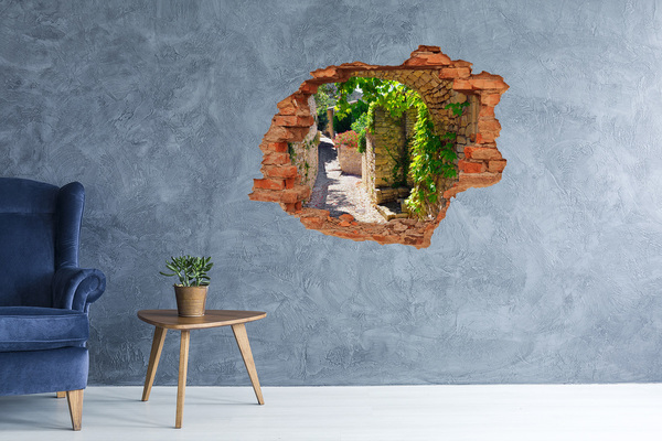 Adesivo effetto buco nel muro Una strada verdeggiante in città