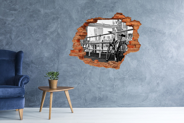 Adesivo effetto buco nel muro Una bicicletta sul molo cittadino
