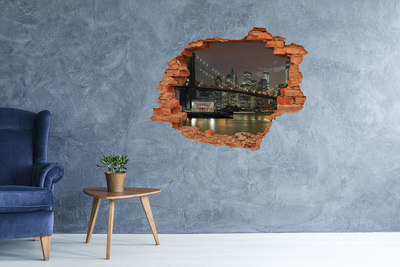Adesivo effetto buco nel muro New York di notte vista attraverso un buco nel muro