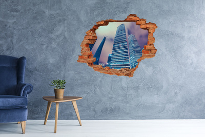 Adesivo con buco sbrecciato Città moderna vista attraverso un buco nel muro