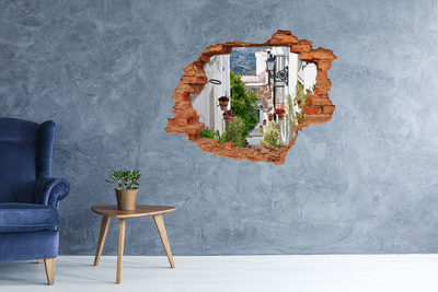 Adesivo effetto buco nel muro Una strada affascinante in un villaggio bianco