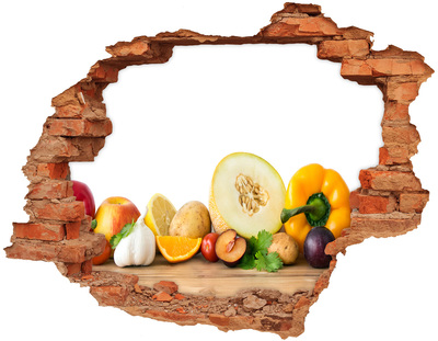 Adesivo con buco sbrecciato Frutta e verdura in un buco nel muro