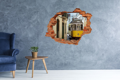 Adesivo murale buco 3D Un tram giallo in una strada stretta