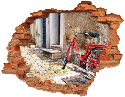 Adesivo effetto buco nel muro Una bicicletta rossa in una strada affascinante