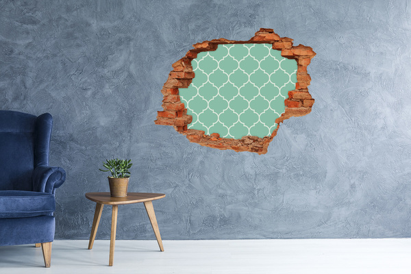 Adesivo con buco sbrecciato Mosaico verde sullo sfondo di un muro danneggiato.