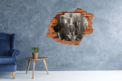 Adesivo con buco sbrecciato Vista della città da un buco nel muro