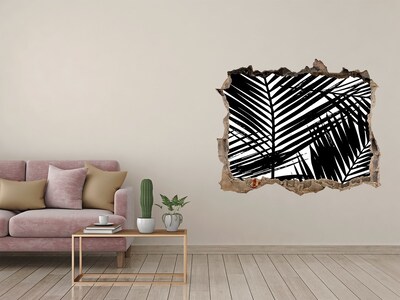 Sticker buco nel muro Foglie tropicali in un buco nel muro