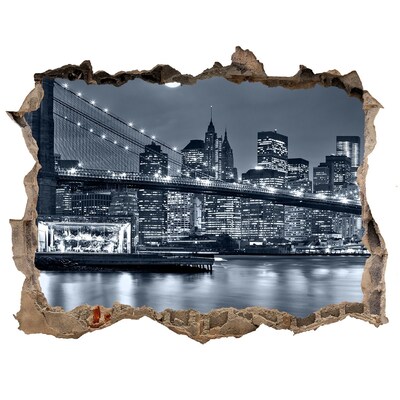 Sticker buco nel muro Il ponte di New York stagliato contro il cielo notturno.