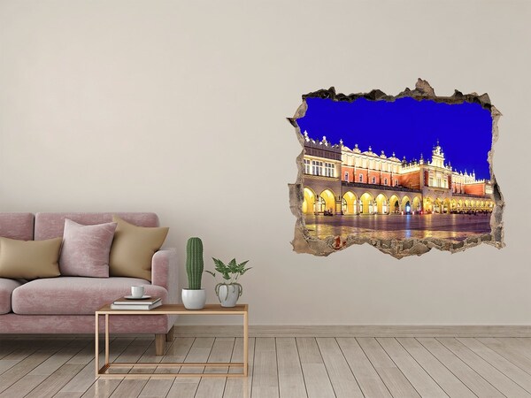 Adesivo buco nel muro La piazza del mercato principale di Cracovia di notte