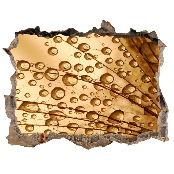 Adesivo buco nel muro Una goccia dorata sullo sfondo di cemento