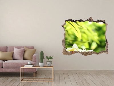 Adesivo buco nel muro Un fiore in un giardino verde