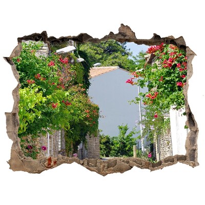 Adesivo buco nel muro Una strada incantevole con fiori