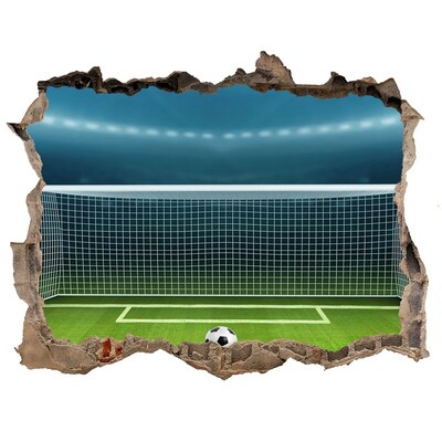 Sticker buco nel muro Lo stadio di calcio dietro il buco nel muro