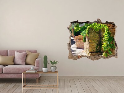 Adesivo buco nel muro Una strada verdeggiante in città