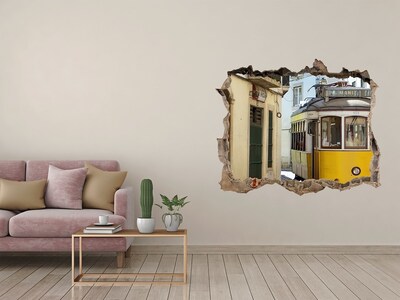 Adesivo buco nel muro Un tram giallo in una strada stretta