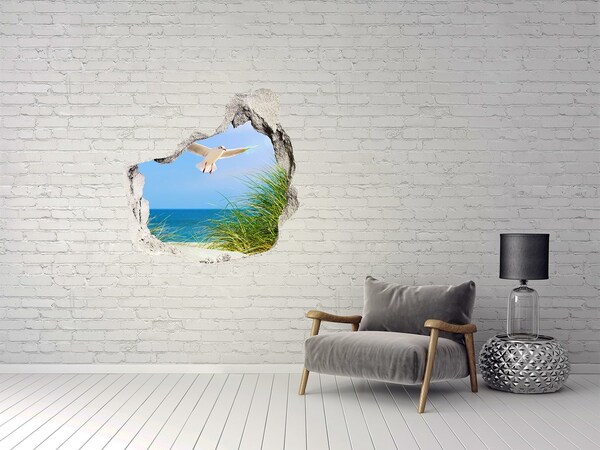 Trompe l'oeil buco nel muro Vista della spiaggia con un gabbiano