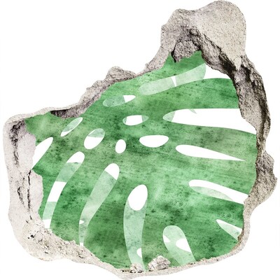 Adesivo effetto buco nel muro Foglia verde in un muro danneggiato