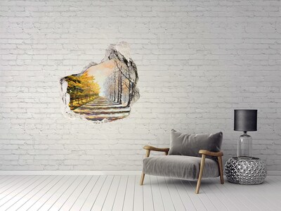 Adesivo effetto buco nel muro Viale d'alberi autunnale