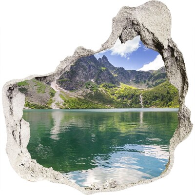 Trompe l'oeil buco nel muro Lago di montagna nella valle