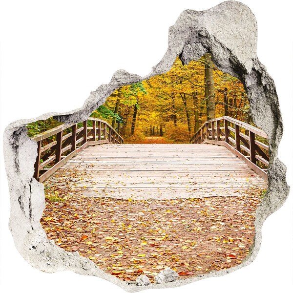 Trompe l'oeil buco nel muro Un ponte nella foresta autunnale