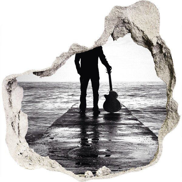 Trompe l'oeil buco nel muro Musicista sul molo