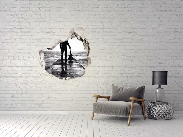 Trompe l'oeil buco nel muro Musicista sul molo